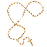 Gold rosary necklace with beads and cross on a white background