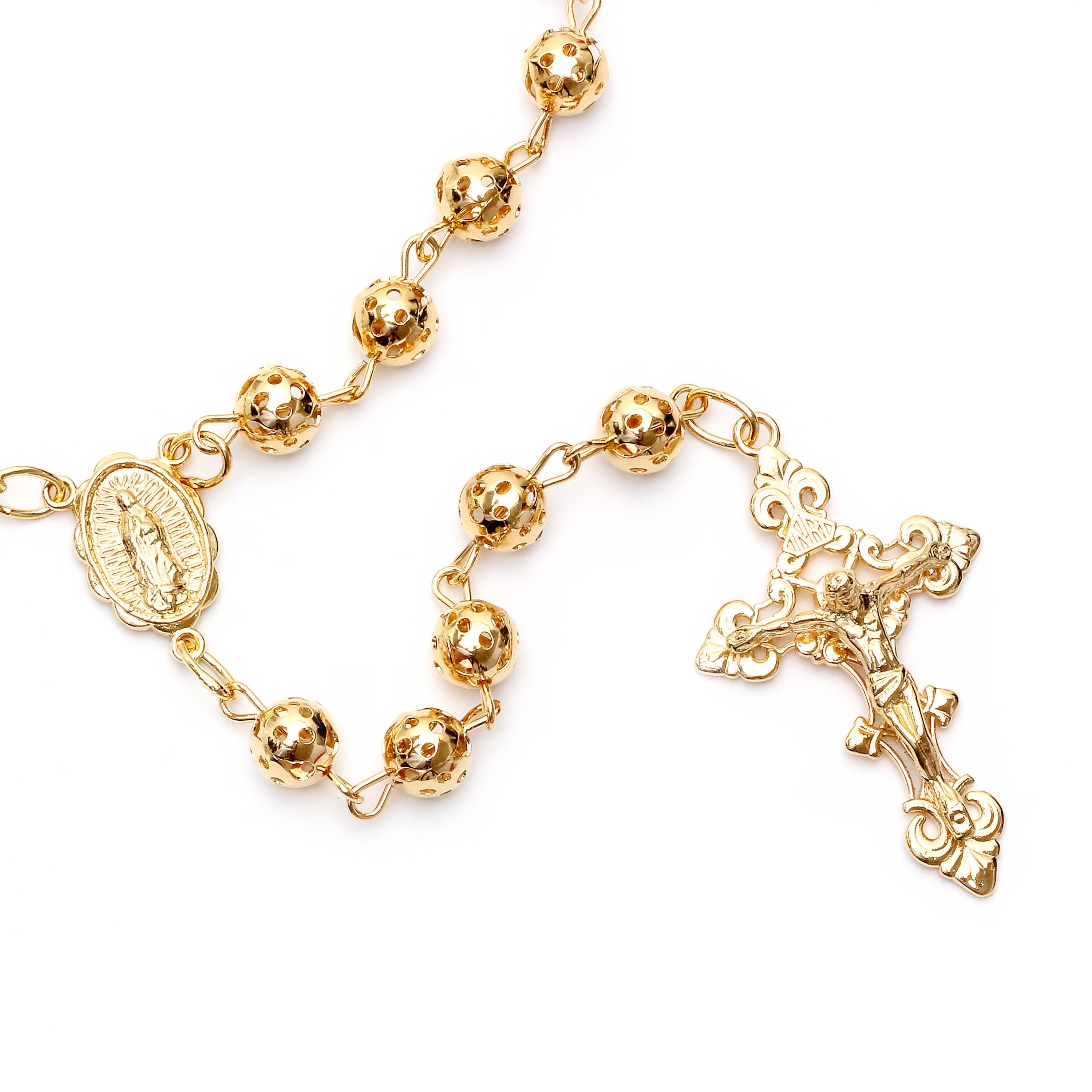 Gold rosary with a cross on a white background