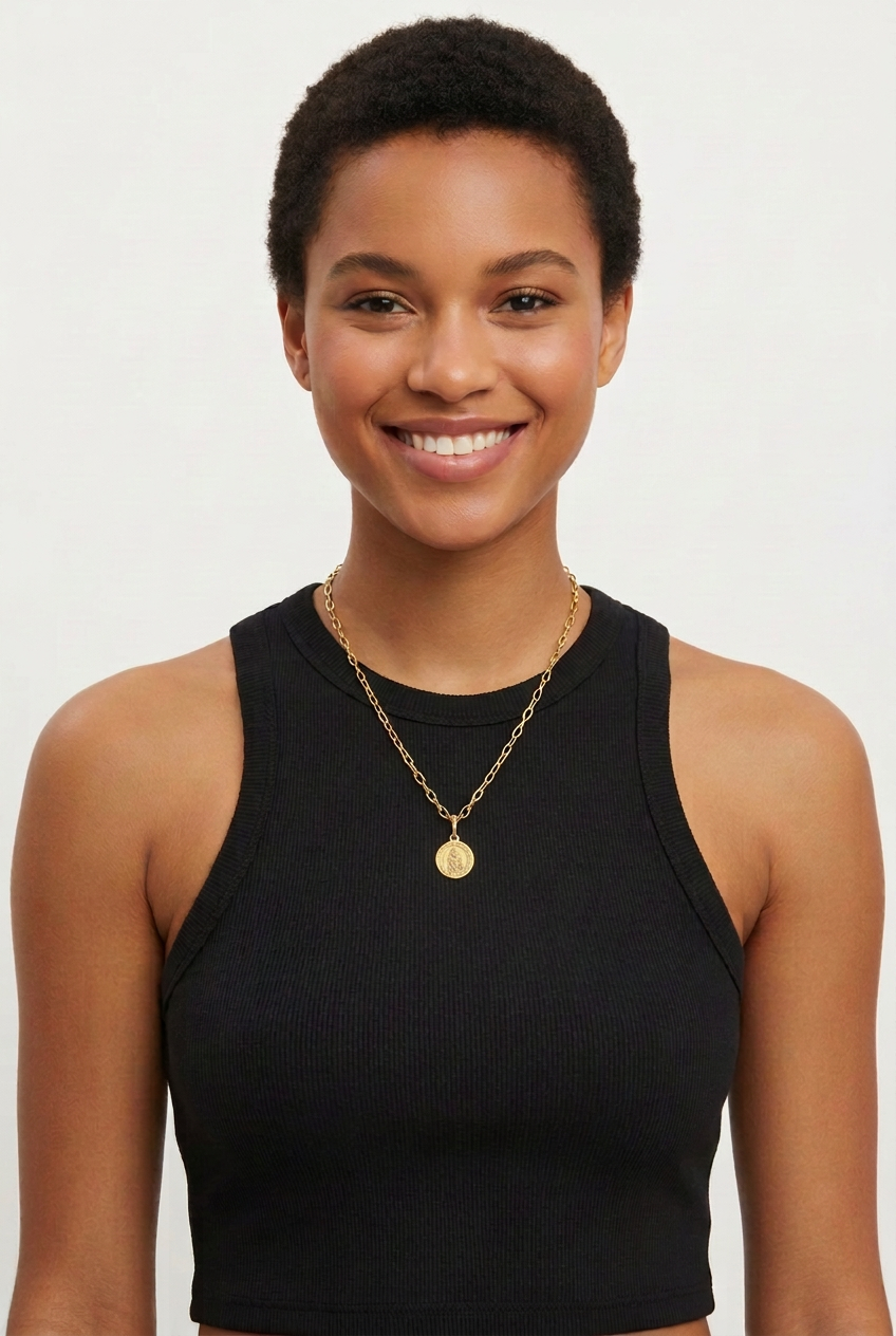 Female model 1 wearing the small St. Christopher medal necklace
