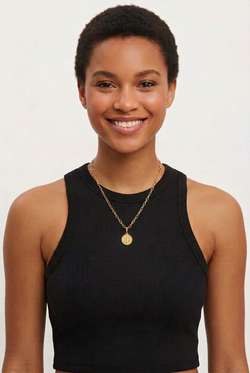 Female model with St. Benedict medal reduced to half its previous diameter