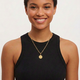 Female model with St. Benedict medal reduced to half its previous diameter