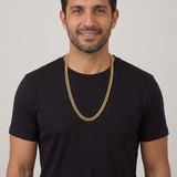 Model A wearing the yellow gold plated Cuban chain with a black T-shirt